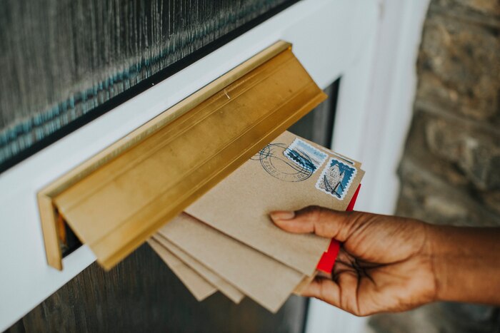Woman picking up the mail